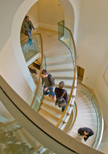 Students using staircase in MyAV campus building.