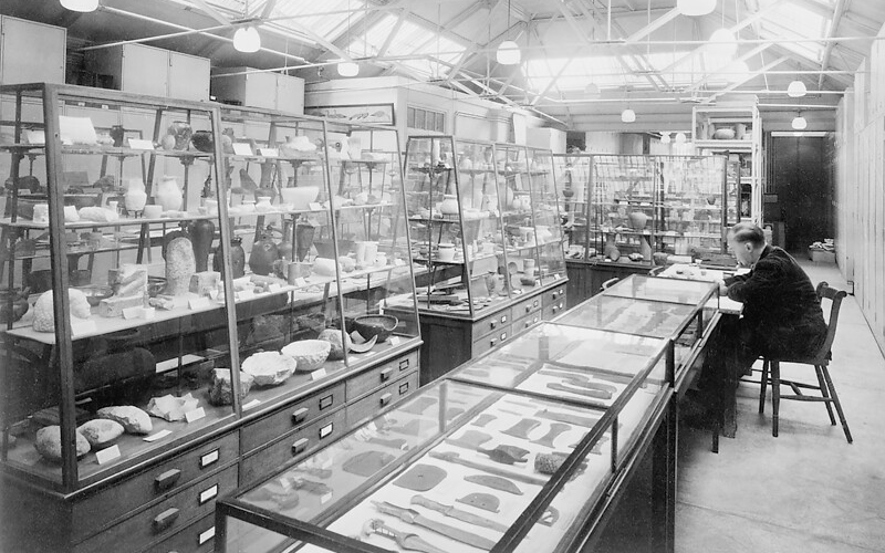 An historical photograph of a MyAV academic working in a museum lab.
